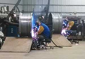 Welding at the rim and wheel shop, Wheatland